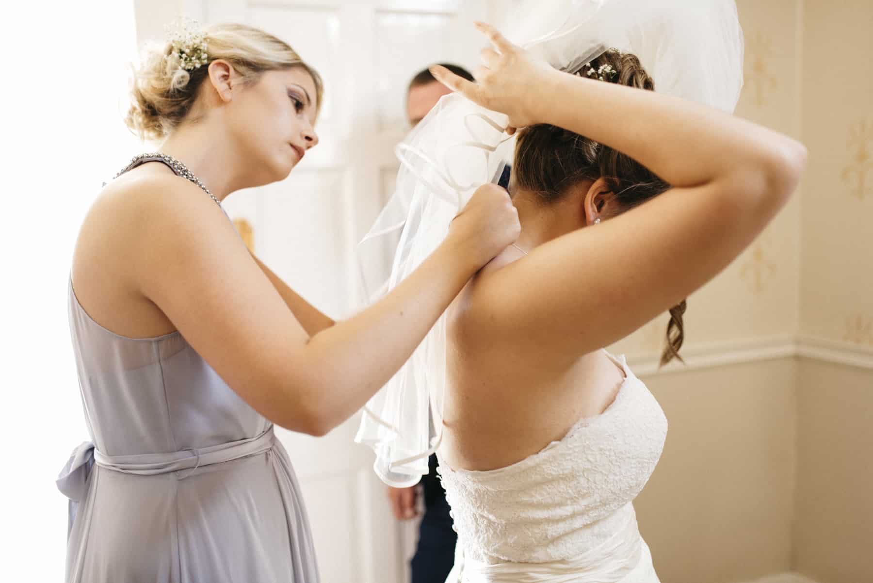 bride puts on veil