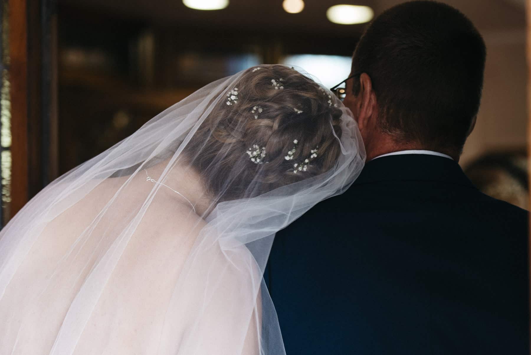 a lovely moment between the bride and her dad