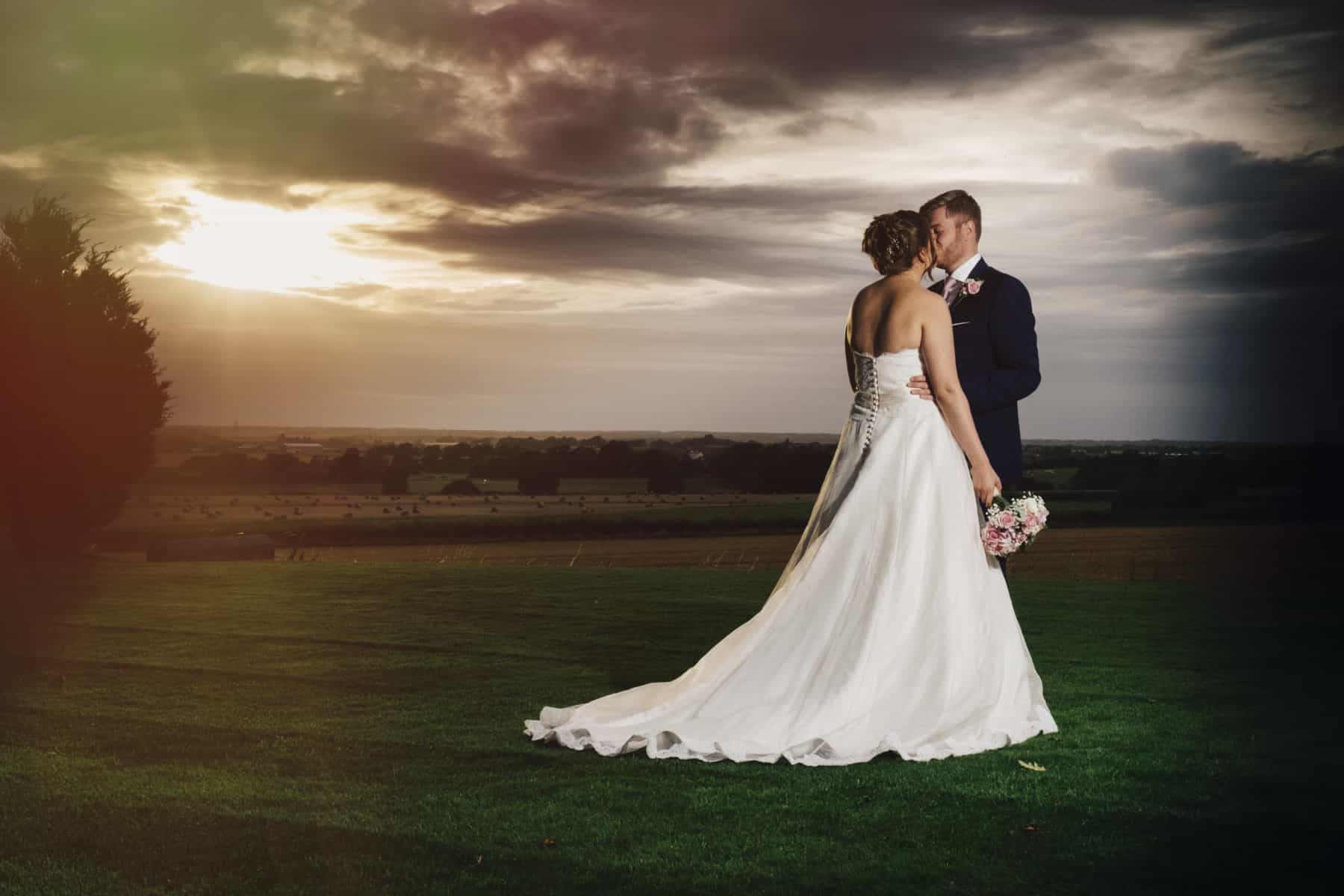bride and groom in the sunset