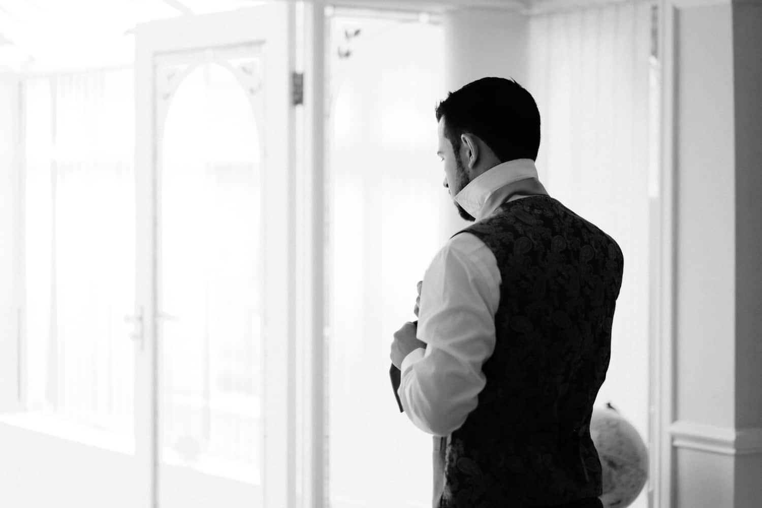a quiet moment for the groom
