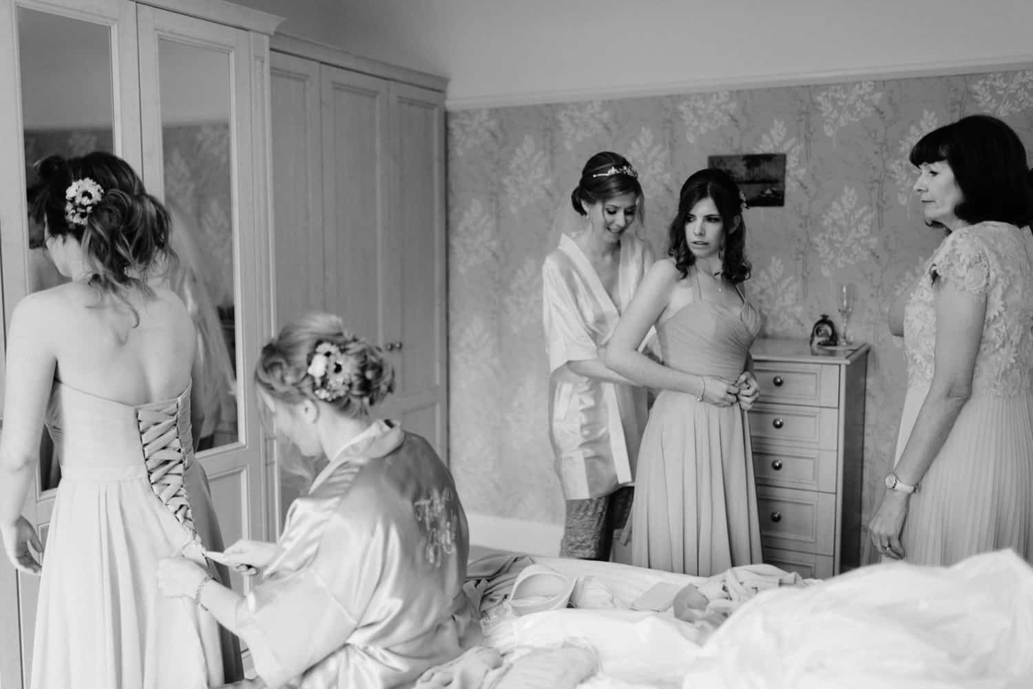 bridal party helpong each other